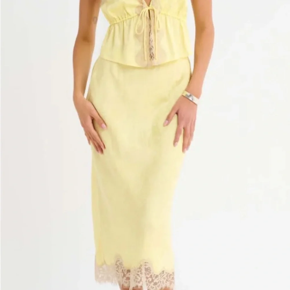 Rumored Pale Yellow Midi Skirt with Lace Hem
